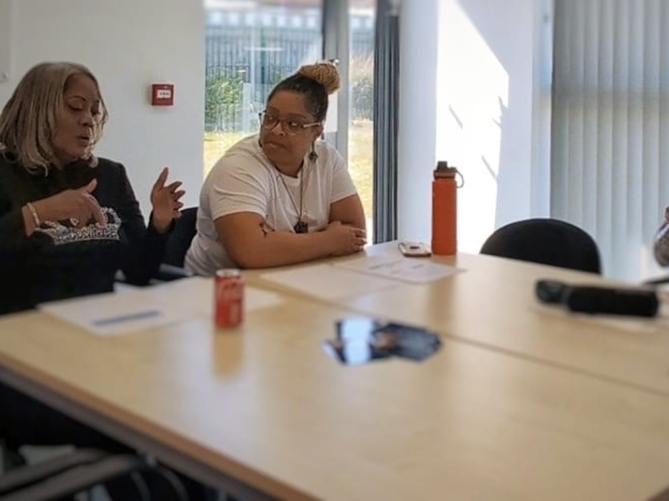 "Menopause Wellness Support Services" "Two women talking about menopause experience as part of a wider wellness support."